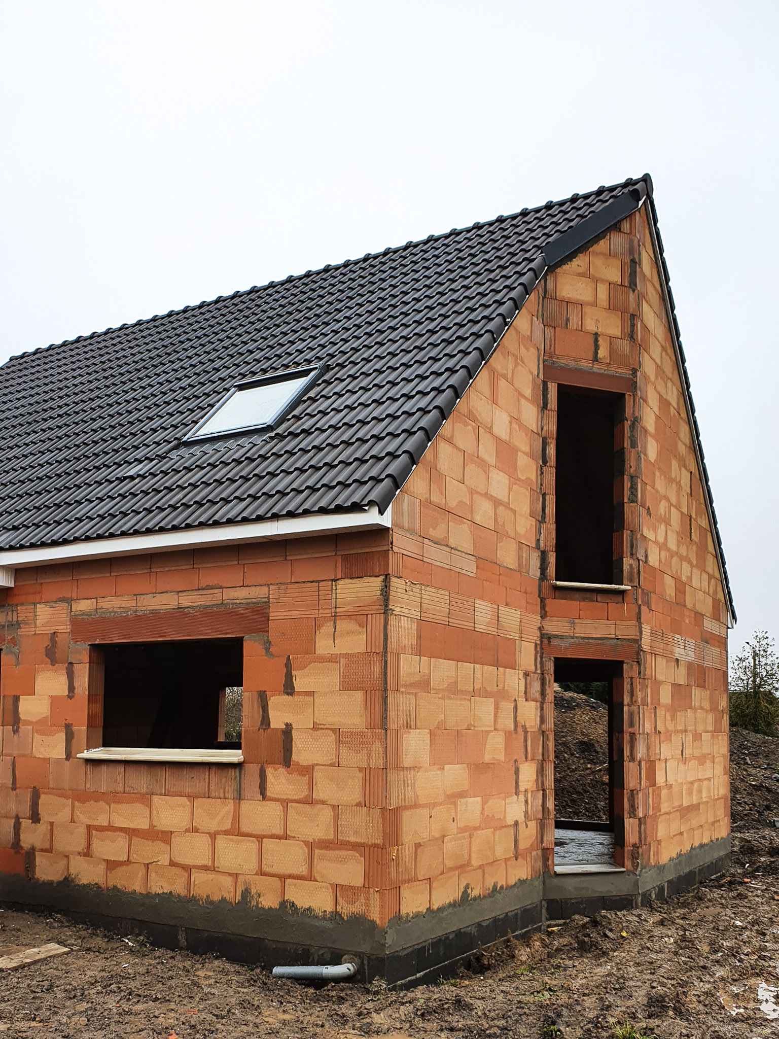 Construction d'une maison avec un pignon complexe à Gien